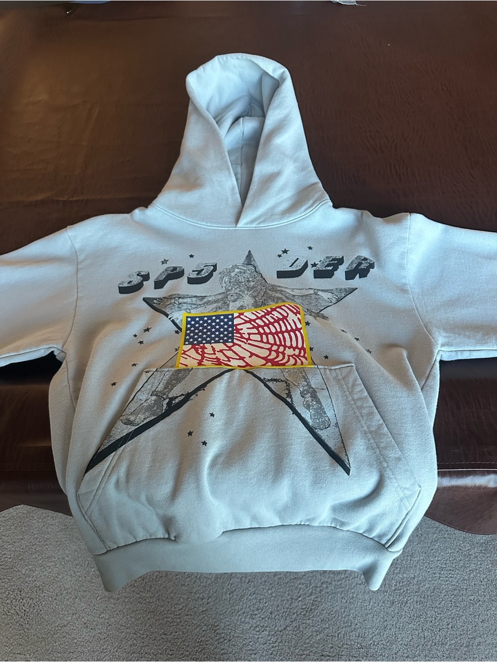 Sp5der Light Gray Graphic Hoodie with Star & Flag Design